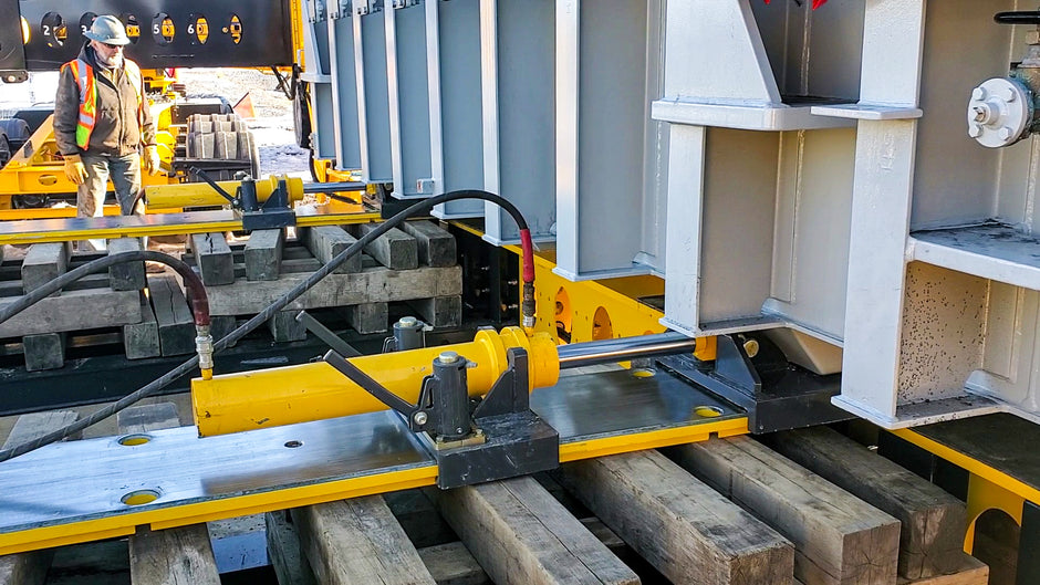 Buckingham Jack and Slide System moving transformer from heavy haul, dual lane trailer