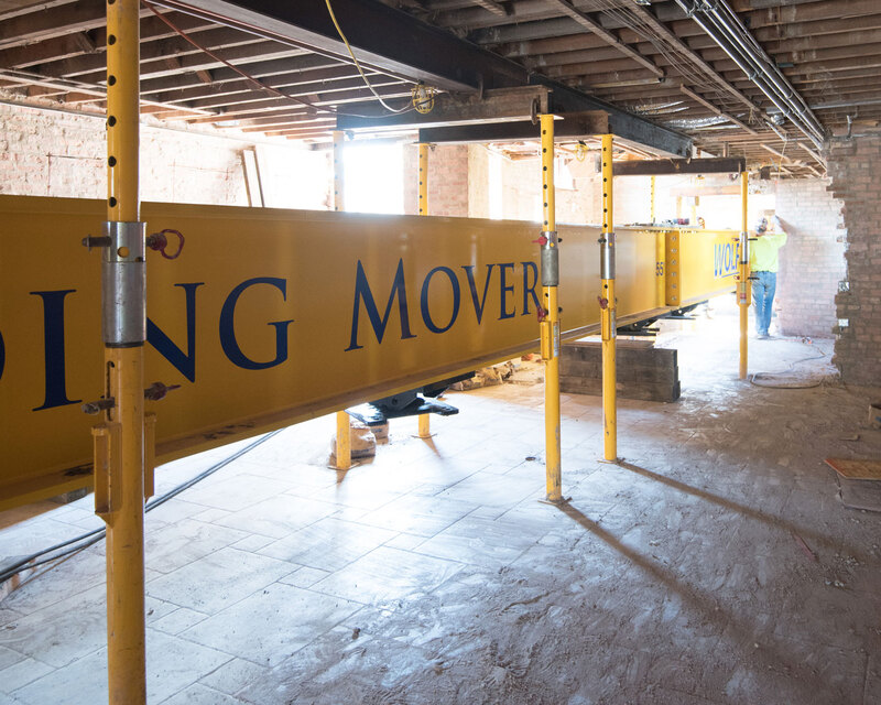 Buckingham Jacking-Shoring Posts supporting steel beam in basement