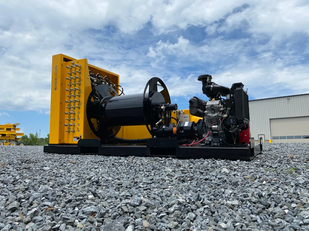 Power hose reel with brake; side feed layout